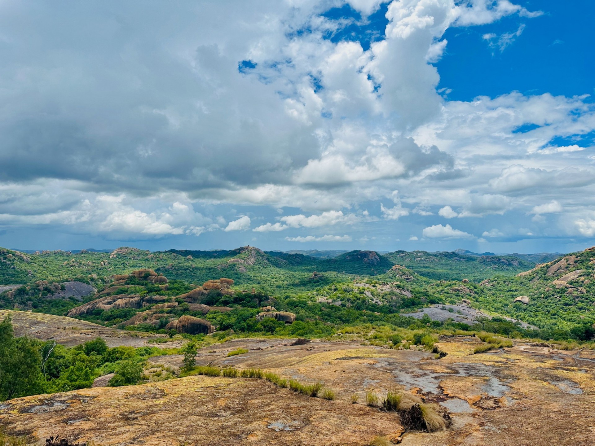 Matobo Landscape. Image of Green and brown hills with cloudy blue sky above